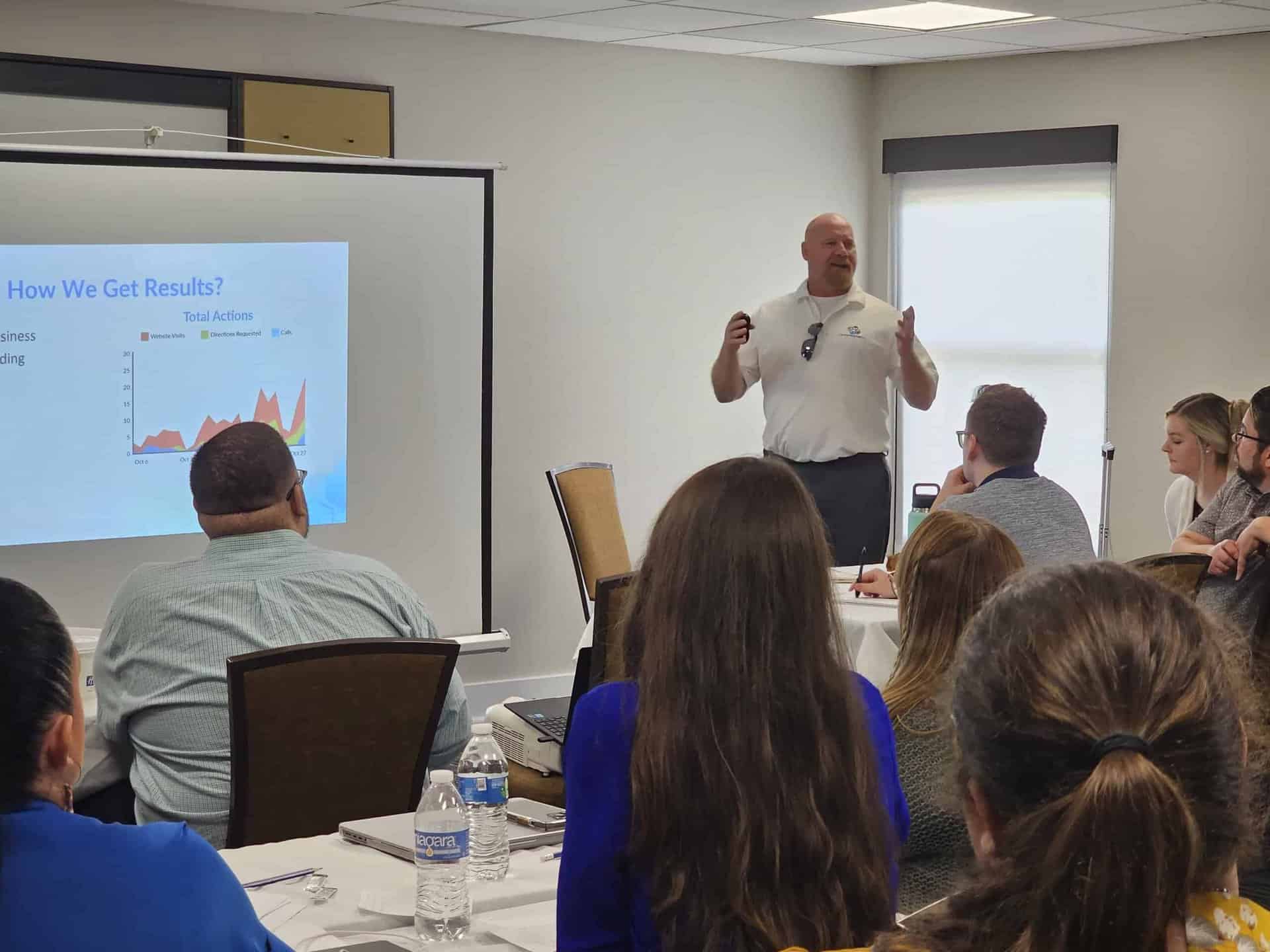 Dan Hale presenting an SEO training session to a room of attendees.